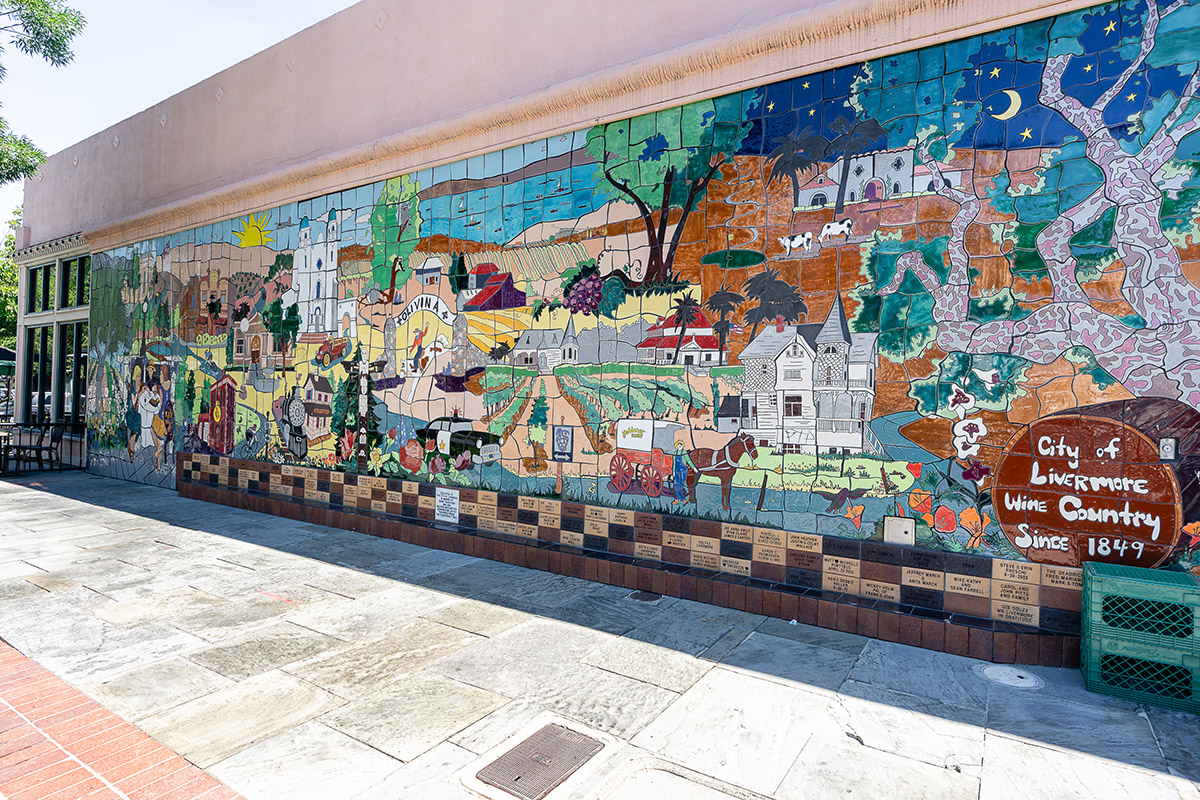 Vibrant mosaic mural showcasing various scenes representing the history and culture of the 